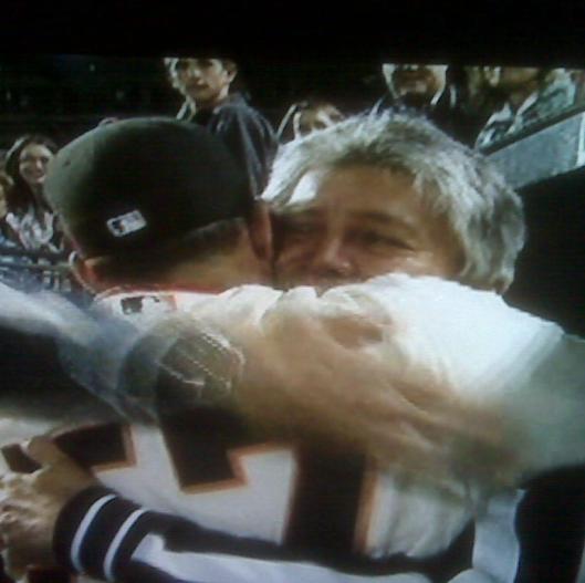 Giants pitcher Jonathan Sanchez hugs his father after pitching a no-hitter