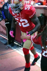 49ersRams100409-032 NFL All-Pro LB Patrick Willis sports his pink gloves and cleats